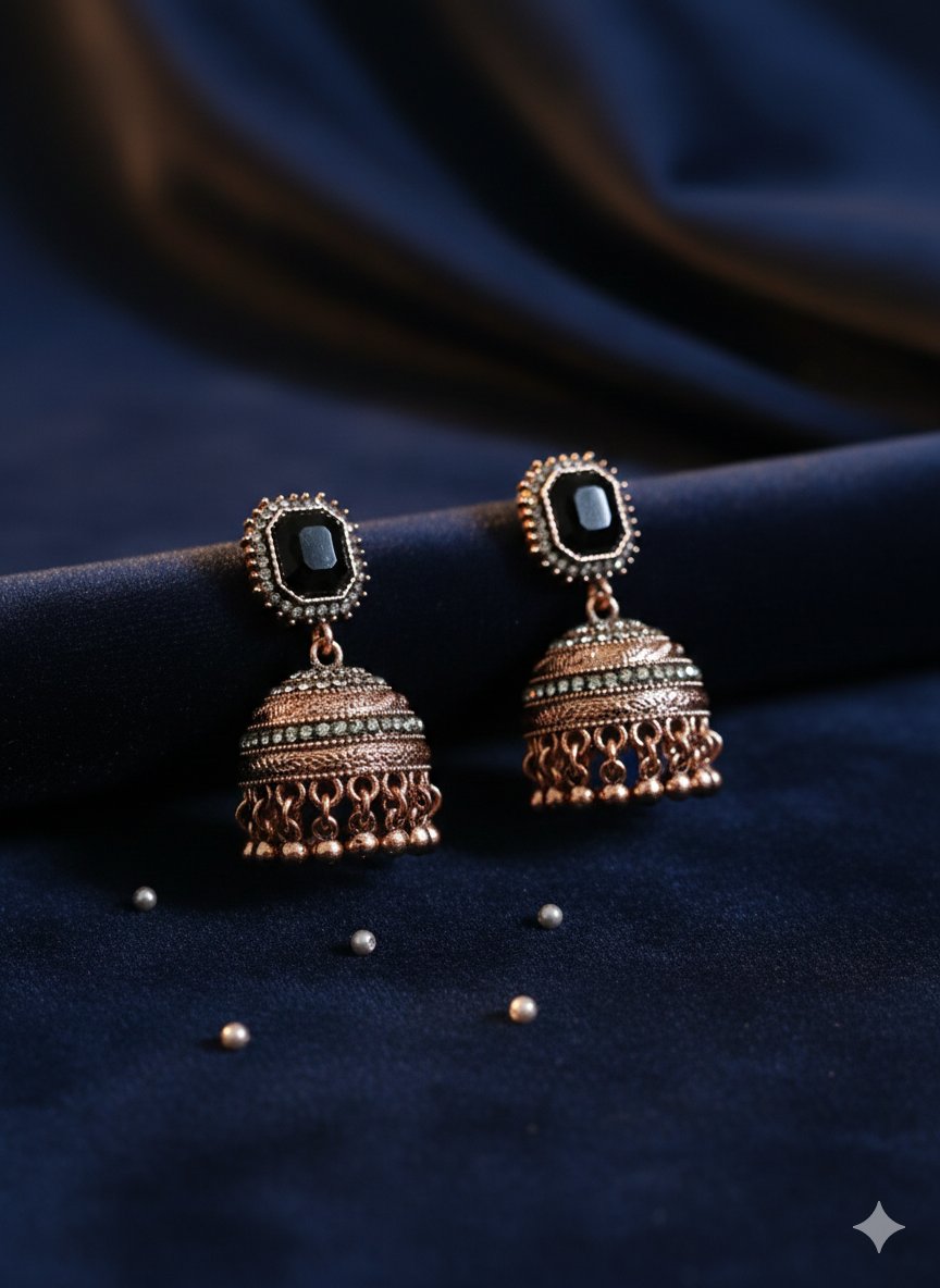 Majestic Royal Black Stone Antique Gold Jhumka Earrings